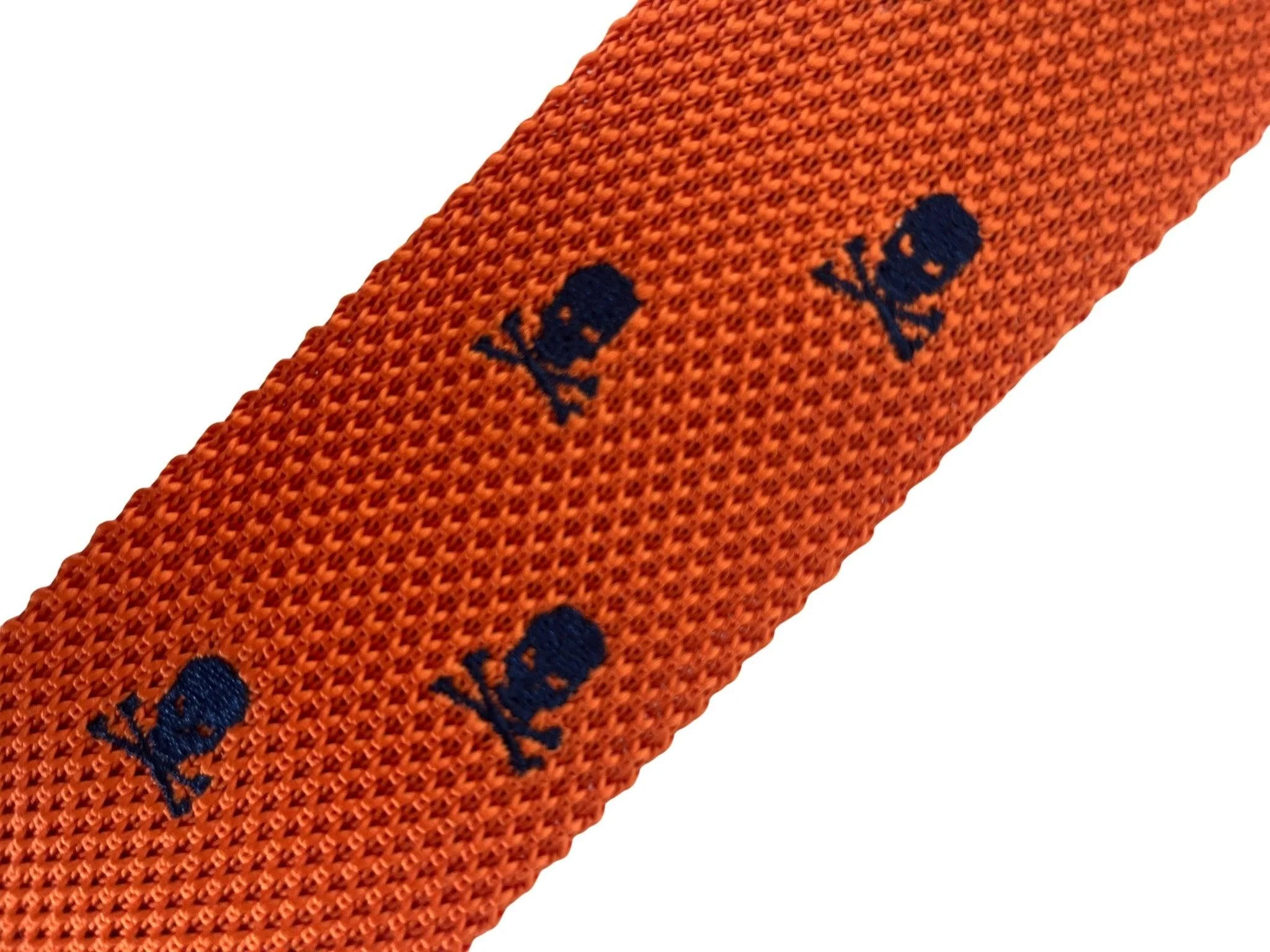 orange knitted tie with embroidered navy skull and crossbone design - Image 2
