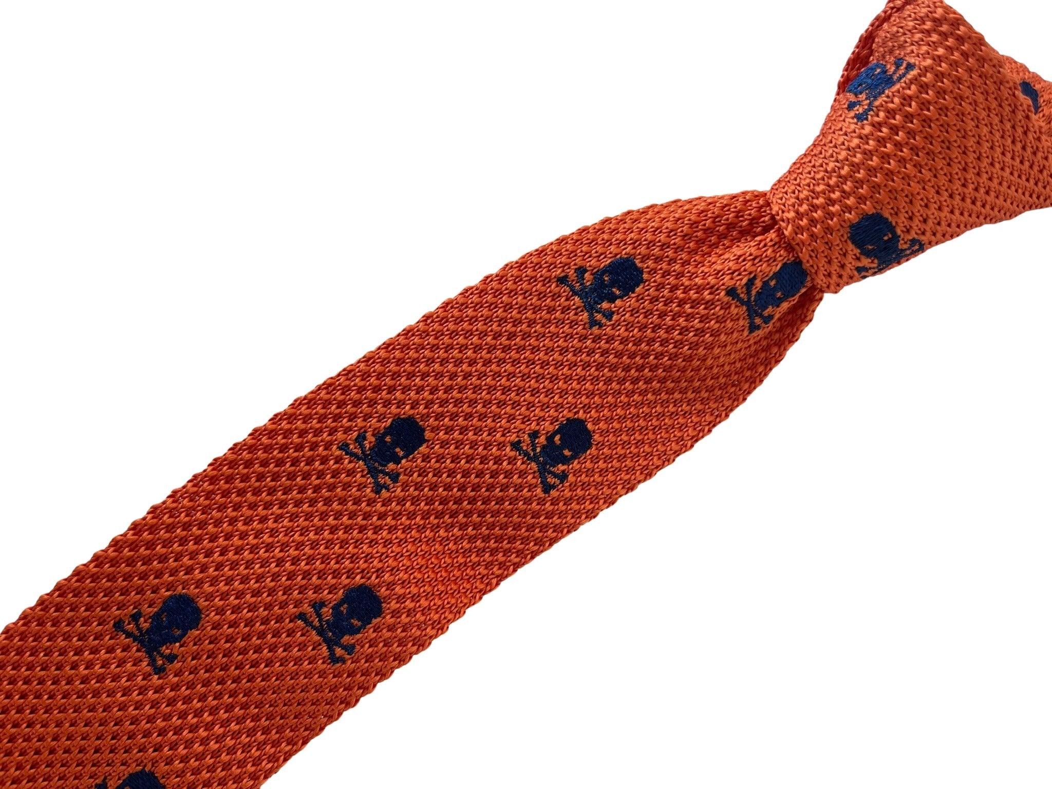 orange knitted tie with embroidered navy skull and crossbone design - Image 4