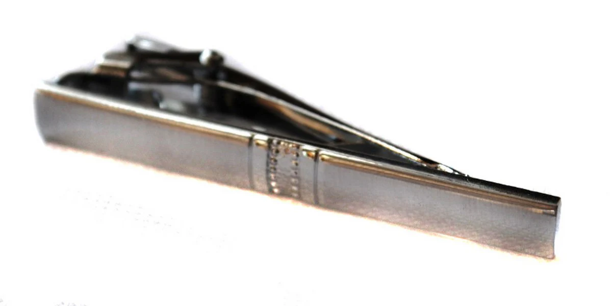 silver tie clip with jeweled pattern